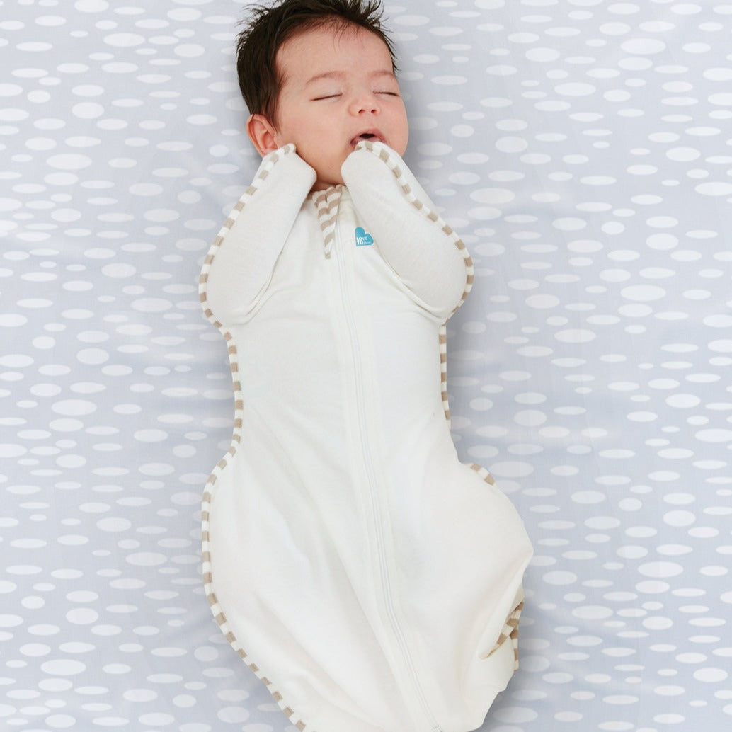 Love to Dream’s Swaddle Up™ is the only zip-up swaddle with patented “wings” that allows your baby to sleep in a natural Arms Up™ position for true Self-Soothing™. Made with organic fabric, the Swaddle Up™ Organic is dreamily soft on delicate skin, and with a 1.0 TOG fabric, it's perfect for moderate climates between 20°C and 24°C.